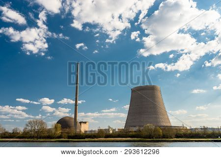 A Half-dismantled Nuclear Atomic Chimney Against A Blue Sky With Clouds In Mulheim-karlich In Wester