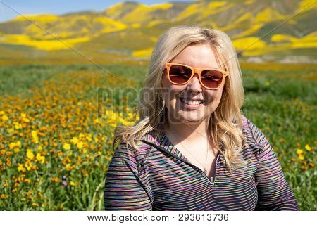 Young Blonde Woman Posing At Carrizo Plain National Monument With Wildflowers During The Superbloom 