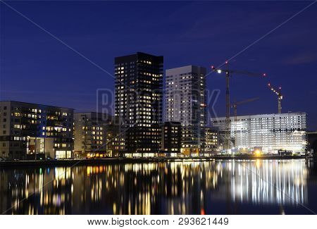 Modern Apartment Buildings Reflection In Water, Night Scen.