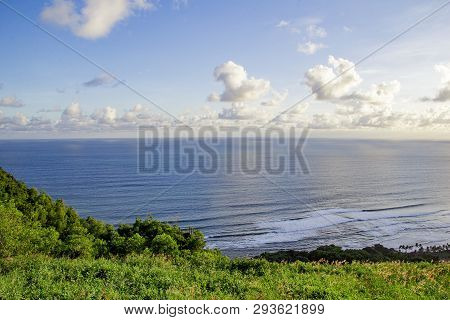 Paragliding Hill Watugupit At Yogyakarta, Beautiful View Of Hill And Sea With Blue Sky And Clouds