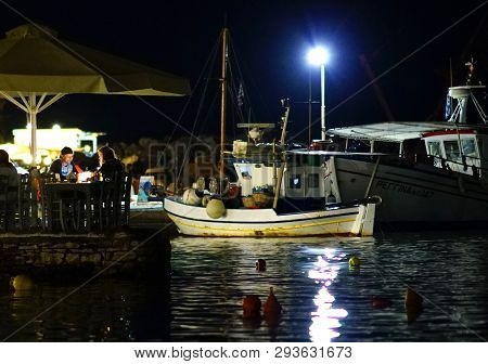 Paros, Greece, 15 September 2018 Night View Of The Port Area Of Aliki, A Fishing Village In Paros Wi
