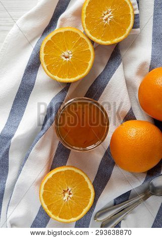 Glass Jar Of Homemade Orange Jam On Cloth, Top View. Flat Lay, Overhead, From Above.