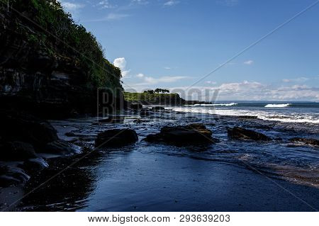 Volcanic Coast With Rocks And Black Sand On Bali, Indonesia