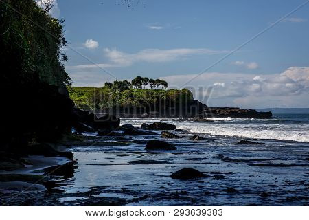 Volcanic Coast With Rocks And Black Sand On Bali, Indonesia