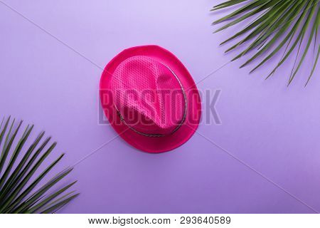 Pink Fashion Summer Hat Isolated On The Violet Or Puprle Backgound, Beach Summer Concept And Holiday