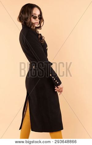 Gorgeous Happy Model Standing Halfly Turned And Smiling.