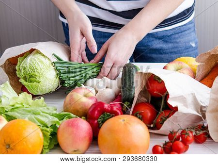 Women's Hands Lay Out Eco Vegan Products