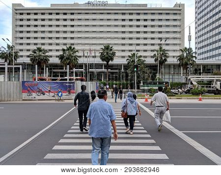 Jakarta, Indonesia - February 16, 2019: Some People Walking On The Pelican Crossing On Jalan Thamrin