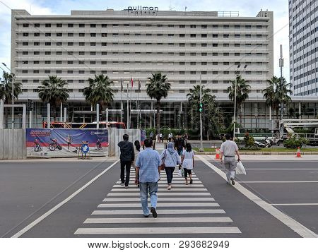 Jakarta, Indonesia - February 16, 2019: Some People Walking On The Pelican Crossing On Jalan Thamrin