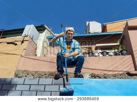 Busan, South Korea, May 01, 2017: Sculpture Of A Man Painting A Wall At Gamcheon Culture Village Ded