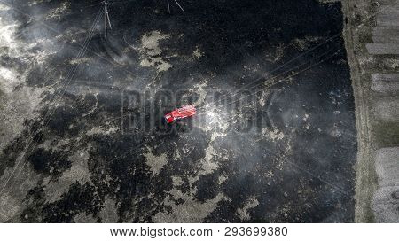 Firefighters Extinguish A Fire In Forest By Water Flooding