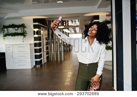 Сheerful Business African American Lady With Afro Hair, Wear White Blouse And Green Pants Posed In C