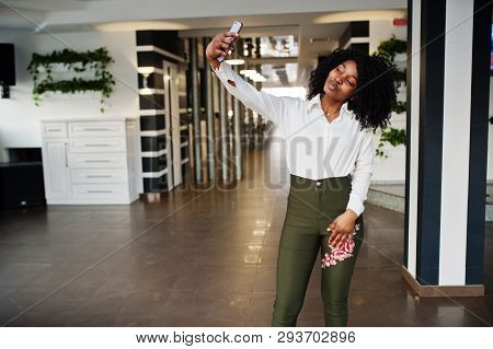 Сheerful Business African American Lady With Afro Hair, Wear White Blouse And Green Pants Posed In C