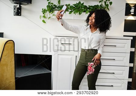 Сheerful Business African American Lady With Afro Hair, Wear White Blouse And Green Pants Posed In C