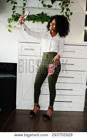 Сheerful Business African American Lady With Afro Hair, Wear White Blouse And Green Pants Posed In C