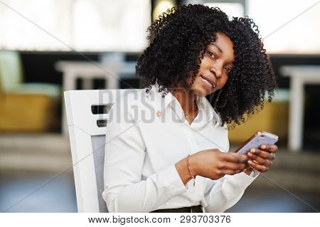 Сheerful Business African American Lady With Afro Hair, Wear White Blouse And Green Pants Posed In C