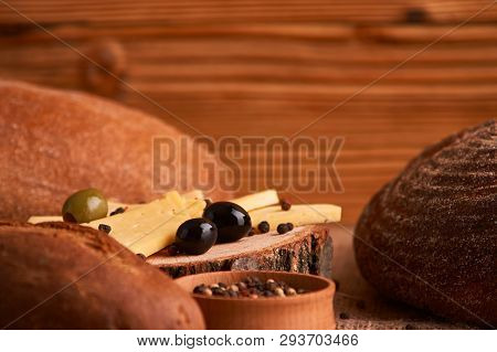 Breads, Cheese, Pepper Peas And Baguette Concept Of Teasty Home Food Close Up On Table