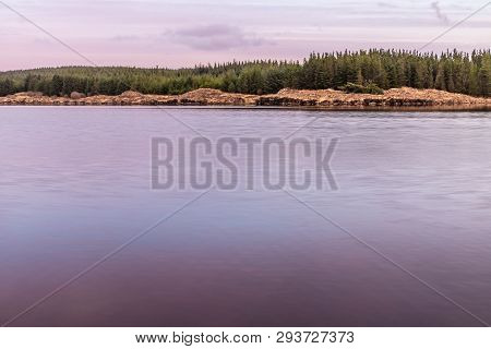 Sunset In Conemara Lake With Pine Forest Around
