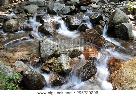 The Flowing Water Of The River Beyond The Odaki-medaki Waterfall On The Nakasendo Road Trail In Japa
