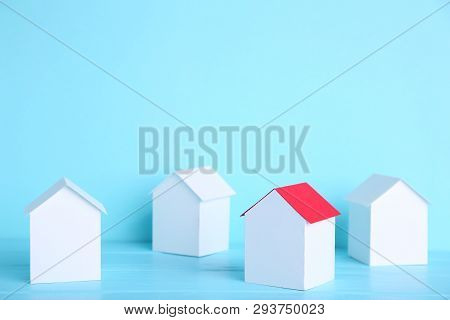 Paper Town. Papercraft House And Papercraft Building On Blue Background