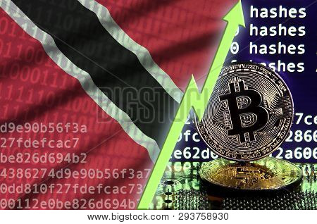 Trinidad And Tobago Flag And Rising Green Arrow On Bitcoin Mining Screen And Two Physical Golden Bit