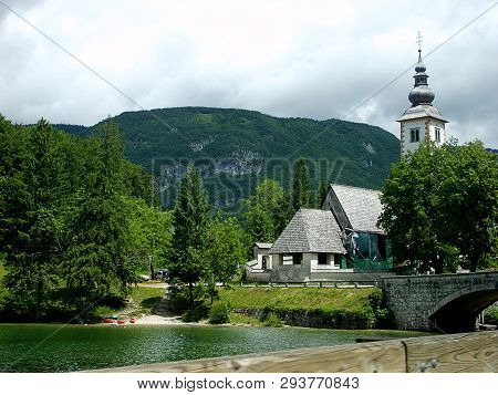 Church Of Sv. John The Baptist And A Bridge By The Bohinj Lake