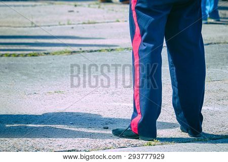 Blue Trousers With A Red Stripe On The Military Man. The Stripes On The Pants