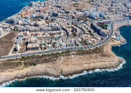 Seaside Cliffs, Colourful Houses And Streets Of Qawra Town In St. Paul's Bay Area In The Northern Re