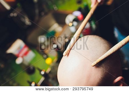 Drum Sticks, Human Head, Headache Concept, Bald.