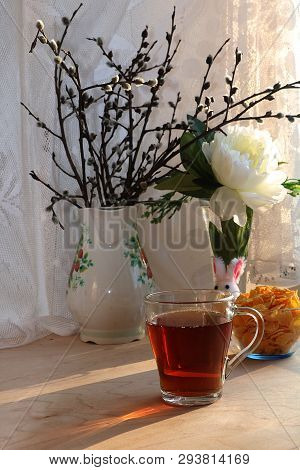 A Mug Of Tea, A Cup Of Corn And A Cake On A Sunny Table, A Bouquet Of Spring Flowers For Mood, Diet 