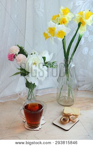 A Mug Of Tea, A Cup Of Corn And A Cake On A Sunny Table, A Bouquet Of Spring Flowers For Mood, Diet 