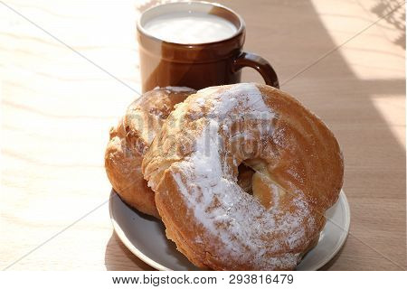A Mug Of Milk, A Cup Of Corn And Cake On A Sunny Table, A Bouquet Of Spring Flowers For Mood, Diet F