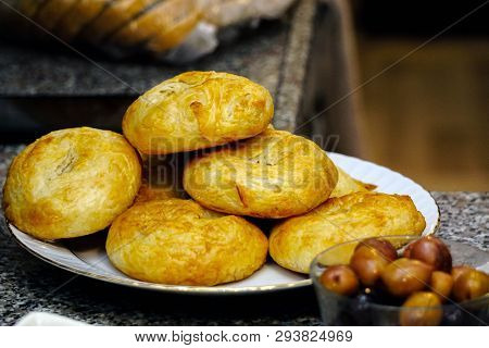 Traditional Smyrna Turkey Pastry Boyoz With Green Olives Close Up View