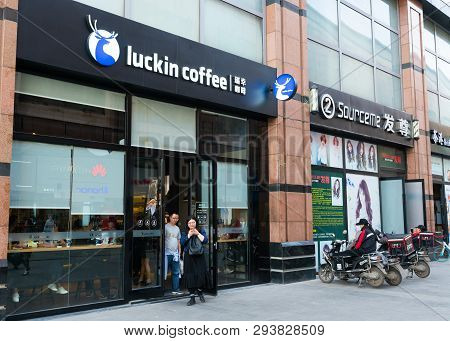 Wuhan China, 6 April 2019 : Street View Of Chinese People Leaving A Luckin Coffee Shop In Wuhan Chin