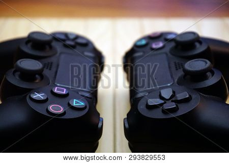 22.03.2019 Eskisehir, Turkey. Two Ps4 Gamepads On Wooden Background Close Up View