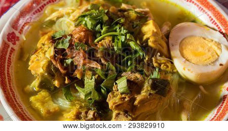 Soto Ayam Is A Chicken Soup Served With Vegetables And Rice - Image