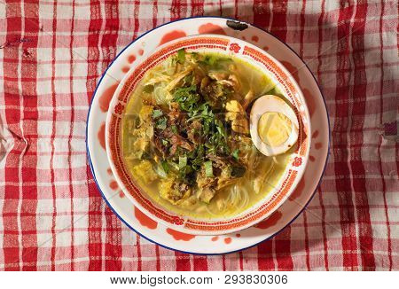 Soto Ayam Is A Chicken Soup Served With Vegetables And Rice - Image
