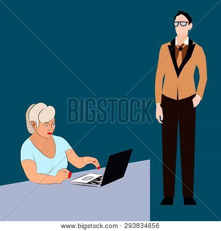 Office Workers. A Man And A Woman Work Together. Office Worker Woman Working On A Laptop. A Man Is S