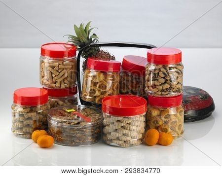 Chinese new year pineapple tarts in jar with pineapple and basket