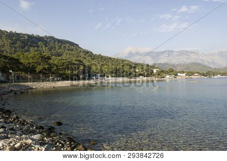 Kemer Antalia Nice View Of The Sea. Beach Kemer Antalia With Sand And Mountains, The Sea With The Sh