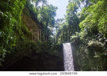 Air Terjun Tibumana. Blowing Waterfall In Bali. Close-up.