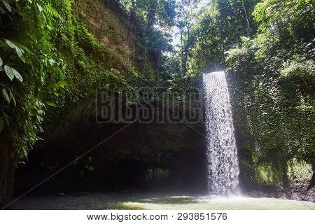 Air Terjun Tibumana. Blowing Waterfall In Bali. Close-up.