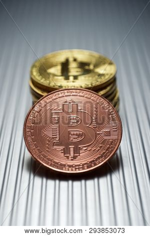 Bitcoins on a metal table.