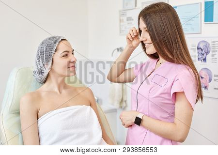 Professional Cosmetologist Examining Of Beautiful Young Female Skin By Cosmetologist Or Dermatologis