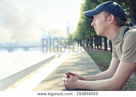 Tourist Enjoying A City View From Quay, Taking A Break And Relaxing
