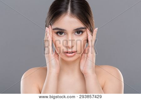 Facial Massage, Wrinkles Prevention. Young Beautiful Woman Massaging Her Face