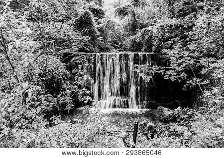 Beautiful Waterfall In The Center Of A Natural Park