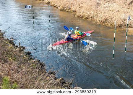 Grodno, Belarus - April, 2019: Kayak Freestyle Competition On Fast Cold Water River Strenuously Rowi