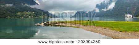 Lustrafjorden Fjord And Mountains Summer Cloudy Landscape, Norway. Panorama.