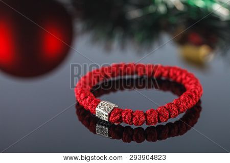 Braided Bracelet Made Of Synthetic Thread. Decoration And Amulet